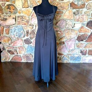 Black sundress with slit on left leg. Zip up from side for size B to see chest.